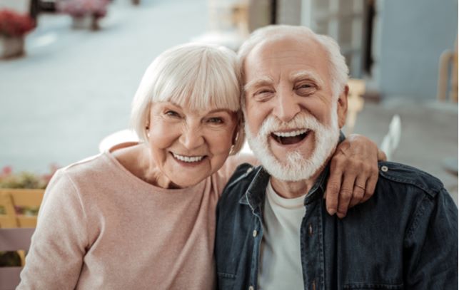 Happy smiling senior couple looking at camera for picture